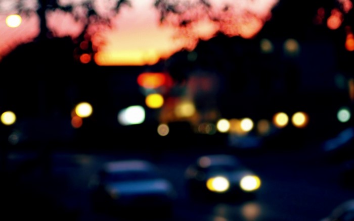 Blurred night city street with car lights