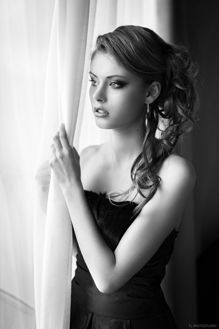 Monochrome portrait of a woman in a black dress