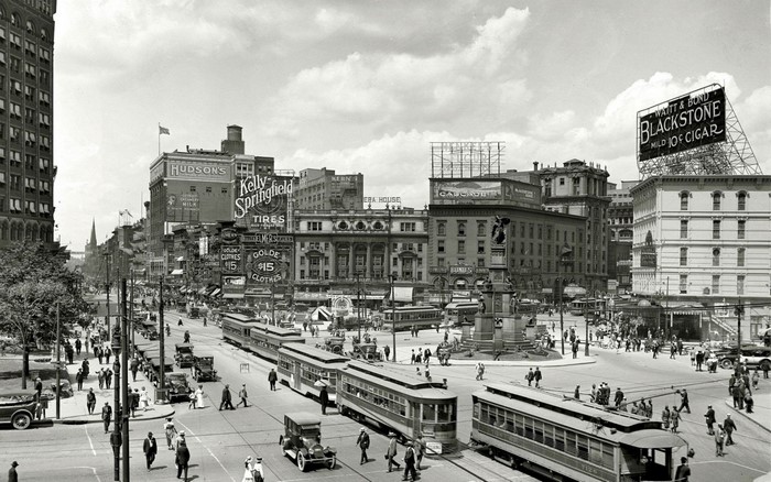 Busy city street with trolleys and pedestrians, Detroit, 1917