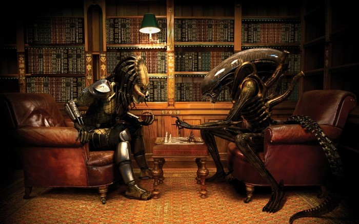 Predator and Xenomorph playing chess in a library
