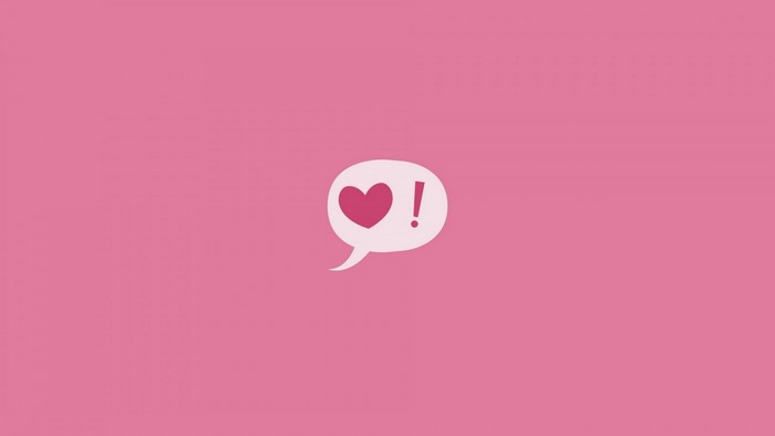 Pink speech bubble with heart and exclamation mark