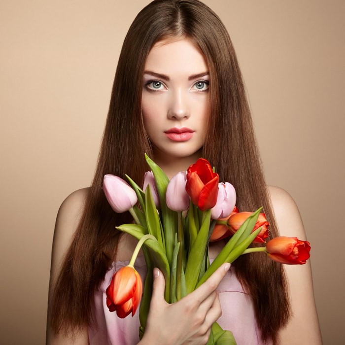 Woman holding a bouquet of tulips