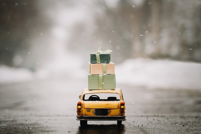 Toy car with presents in the snow