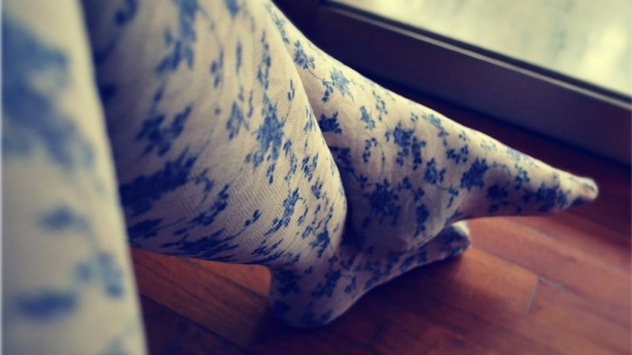 Close up of legs wearing floral patterned tights