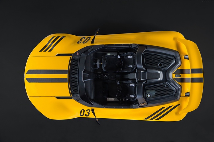 Yellow Vuhl 05 sports car with black stripes