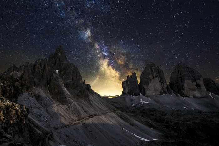 Milky Way over Tre Cime di Lavaredo mountains at night