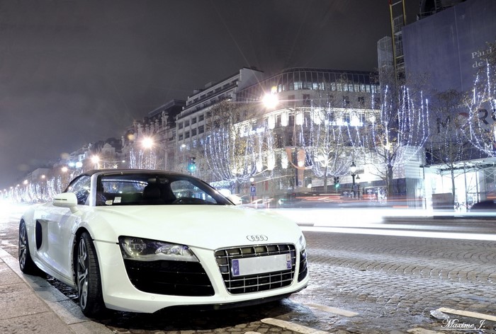 White Audi R8 parked on a street at night