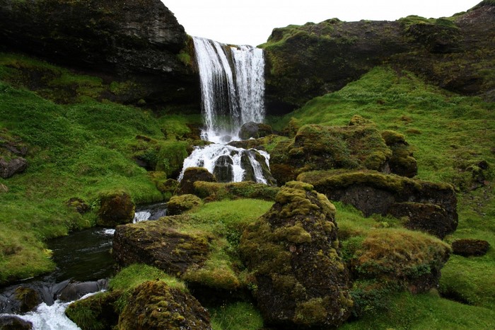 Waterfall cascading over mossy rocks in Iceland