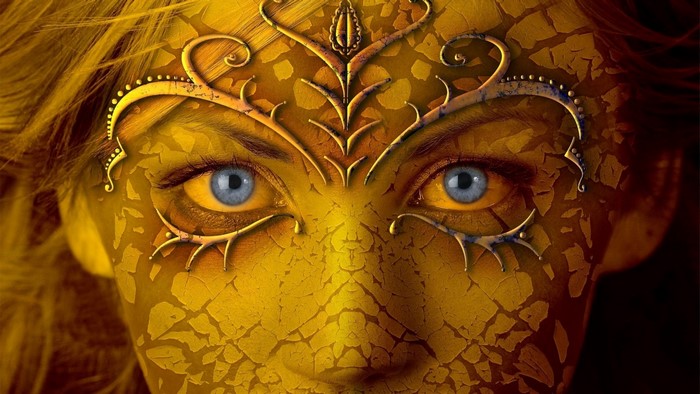 Woman with golden cracked face and ornate mask