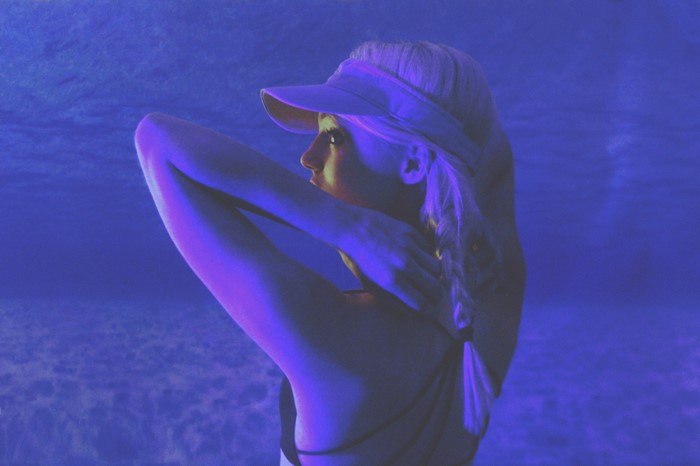 Woman with blonde hair wearing a visor
