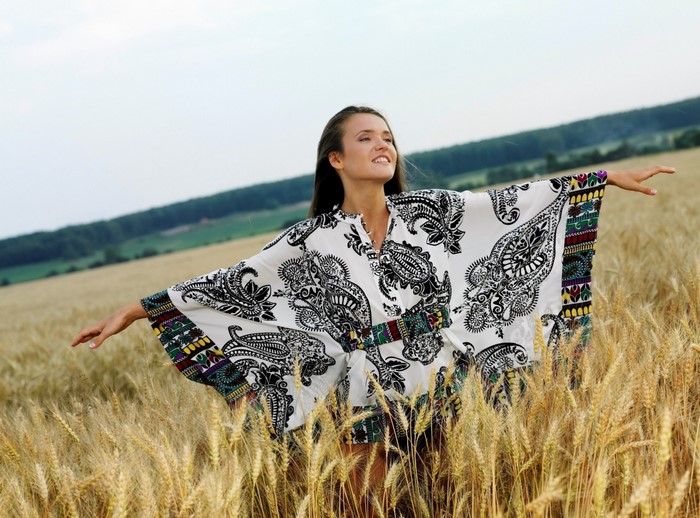 Woman in a patterned kimono in a wheat field