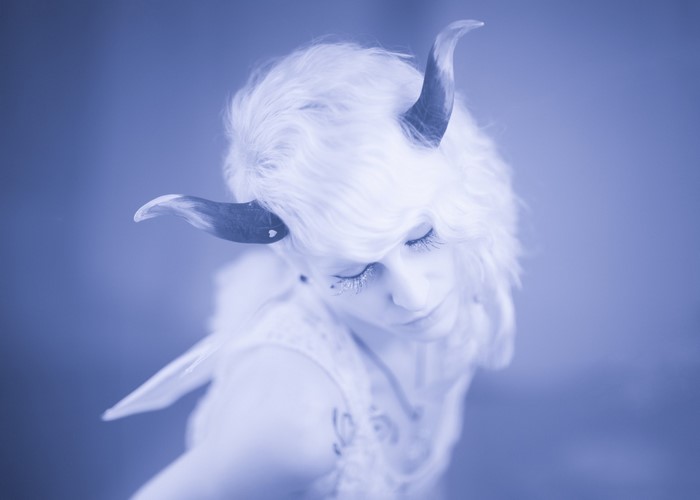 Woman with white hair and horns