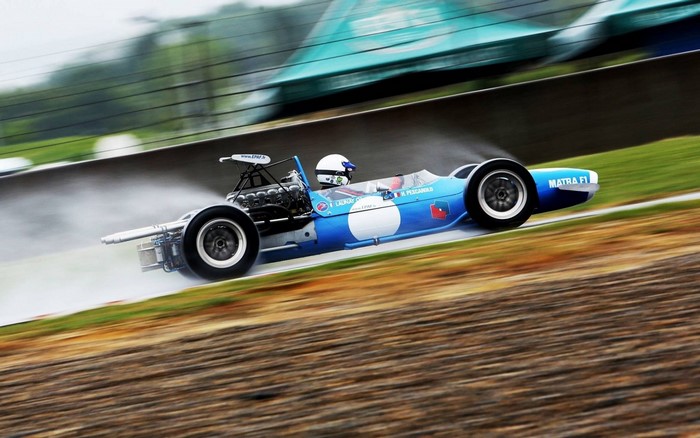 Matra F1 race car driving on a wet track