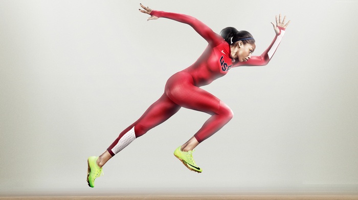 Allyson Felix running in a red Nike USA bodysuit