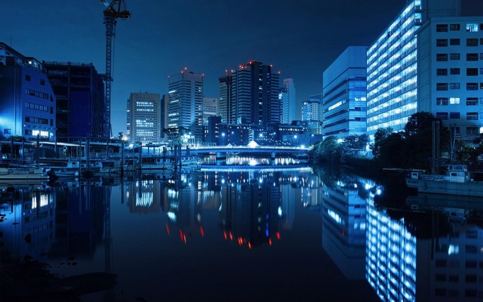 Cityscape reflection in water at night