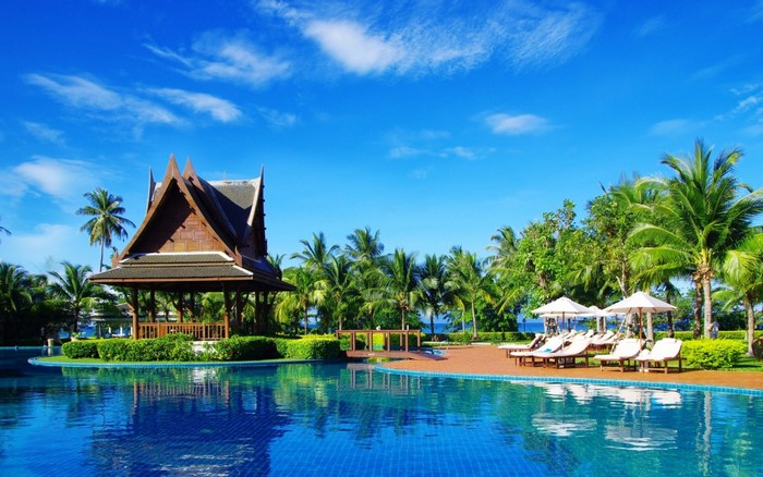 Tropical resort with swimming pool and traditional pavilion
