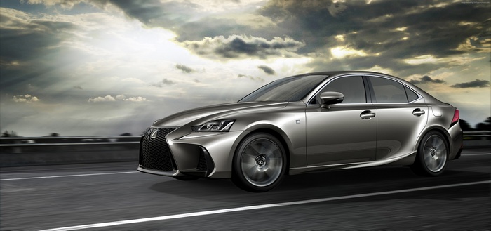 Silver Lexus IS driving on a highway