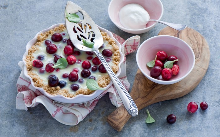 Cranberry dessert with cream and berries
