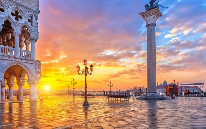 Venice square at sunrise with Doge's Palace and column