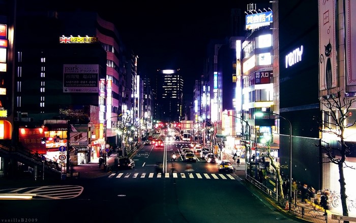 Night street in Japan with city lights and traffic
