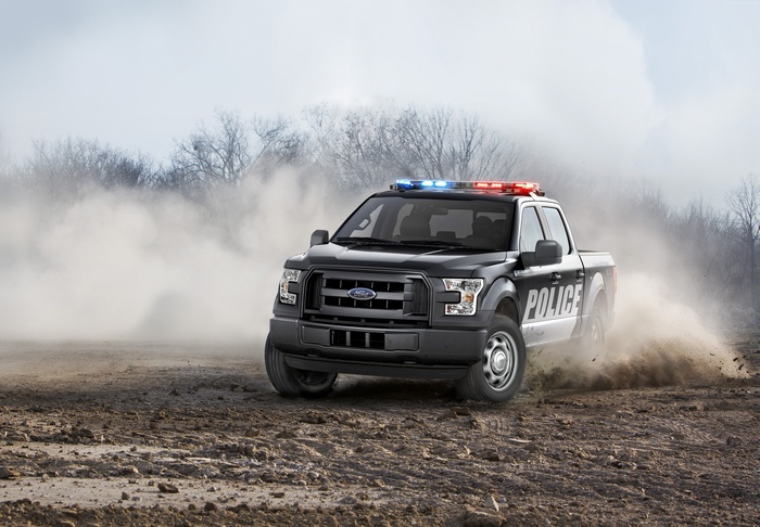 Ford F-150 Police Interceptor truck driving in dust