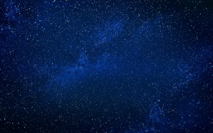 Starry night sky with galaxy and nebula