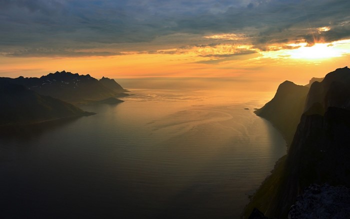 Sunset over a Norwegian Fjord with Mountains
