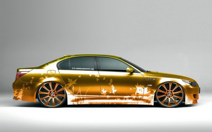 Gold BMW M5 Sedan with Leaf Graphics