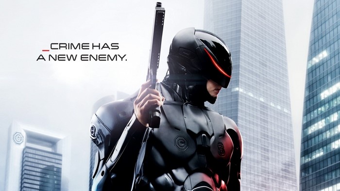 RoboCop with gun in front of skyscrapers