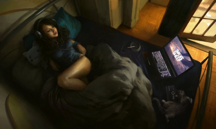 Woman listening to music on bed with laptop and cat