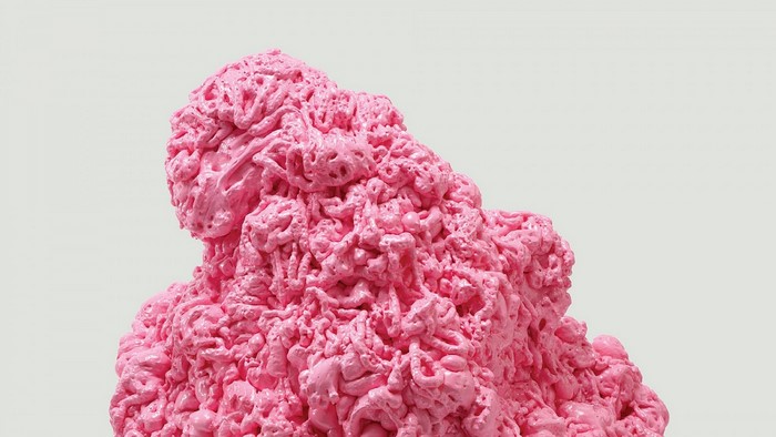 Pink abstract sculpture resembling meat or foam