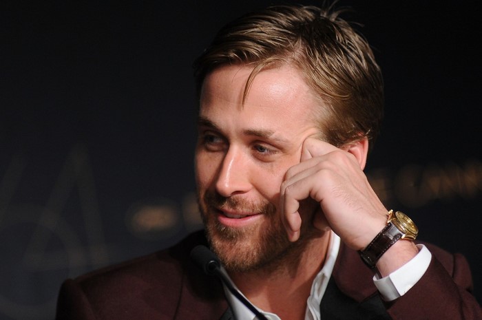 Ryan Gosling wearing a suit and watch