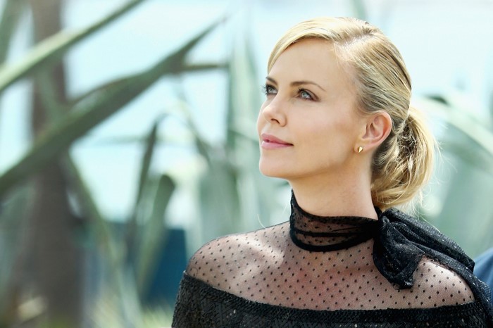 Charlize Theron in a black dress