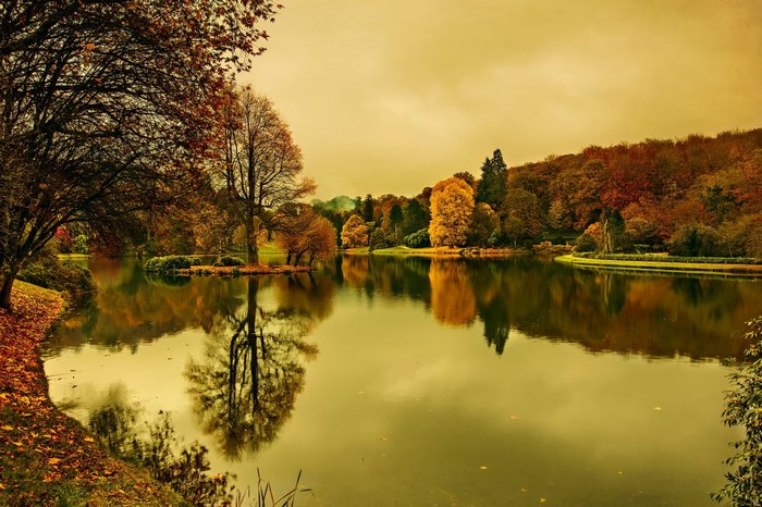 Autumn lake with trees reflecting in the water