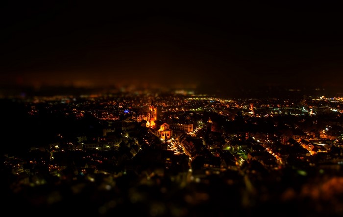 Cityscape at night with illuminated buildings