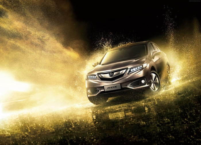 Acura RDX splashing through golden water
