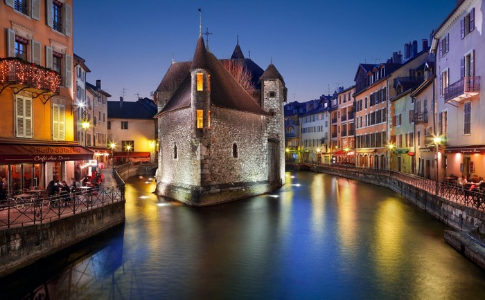 Annecy, France at night with canal and historic buildings