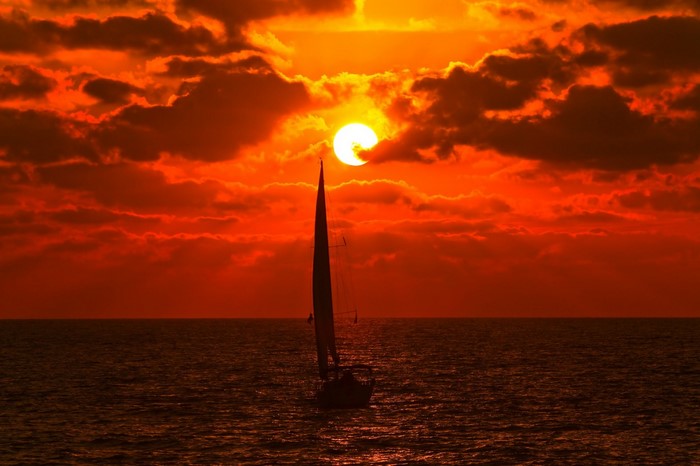Sailboat on the sea during a vibrant sunset