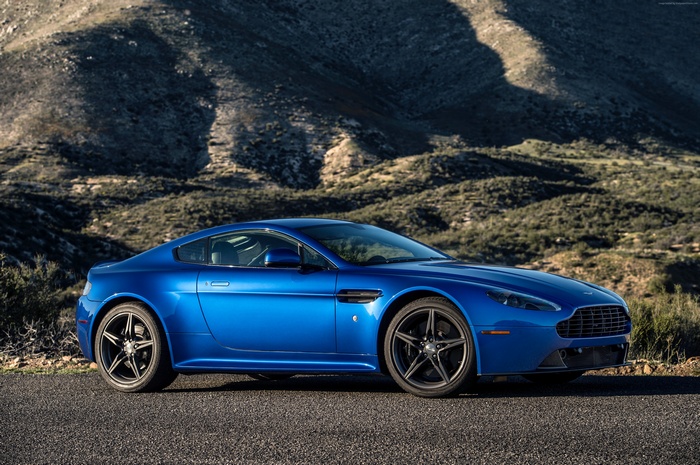 Blue Aston Martin V8 Vantage GTS on a road