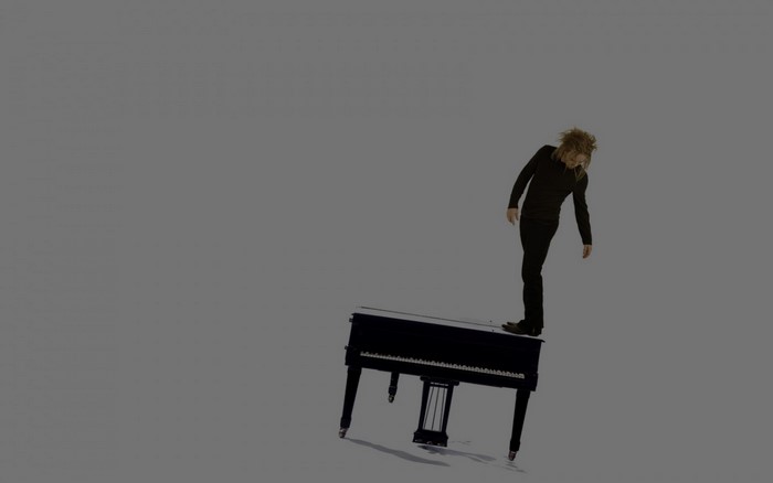 Man standing on a piano
