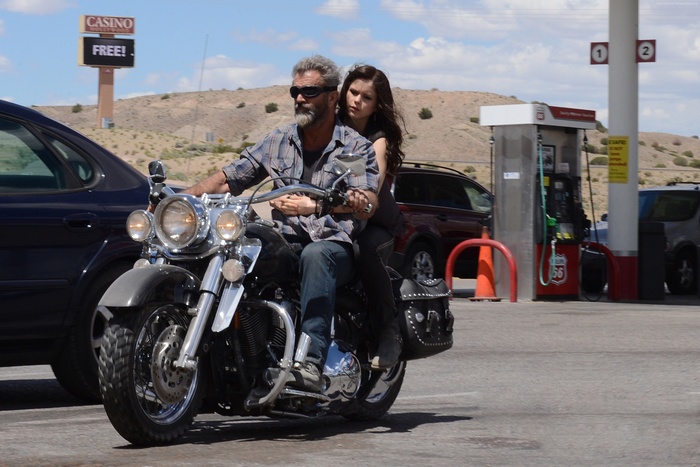Mel Gibson and Erin Moriarty on a motorcycle