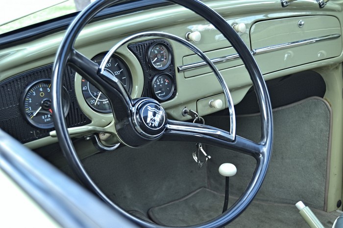 Volkswagen Beetle interior with steering wheel and dashboard