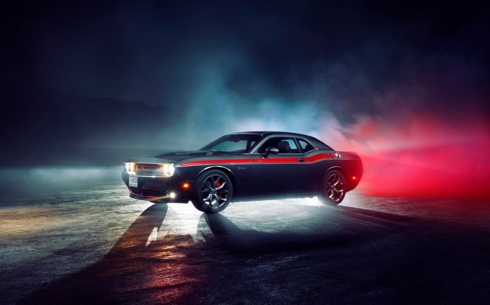 Dodge Challenger with red stripe in smoky lighting