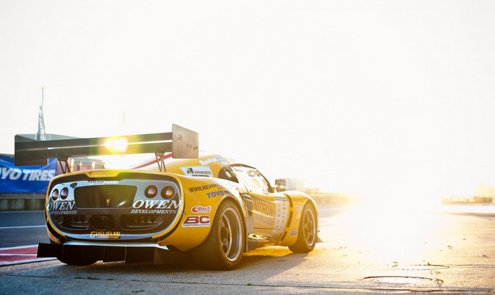 Yellow Owen Developments race car with large rear wing