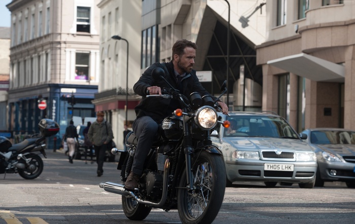 Ryan Reynolds on a motorcycle in London