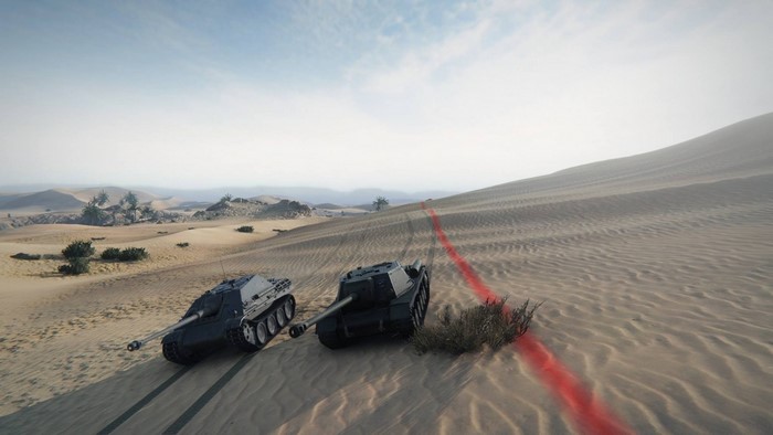 Two tanks in a desert landscape