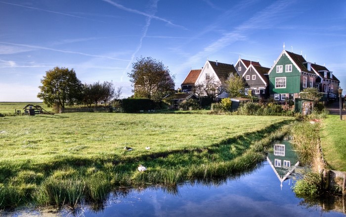 Rural village with houses and a canal