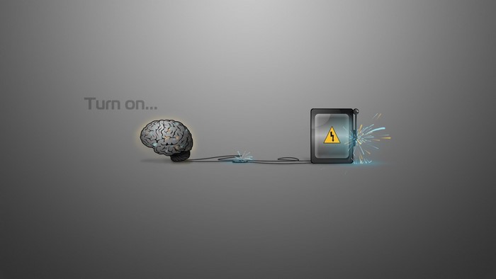 Brain connected to power source with warning sign