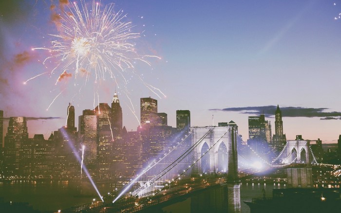 Fireworks over Brooklyn Bridge and New York City skyline
