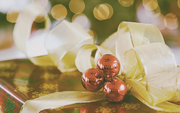 Christmas gift with ornaments and ribbon